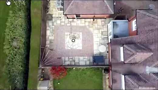 Aerial view of a patio with a circular paving pattern